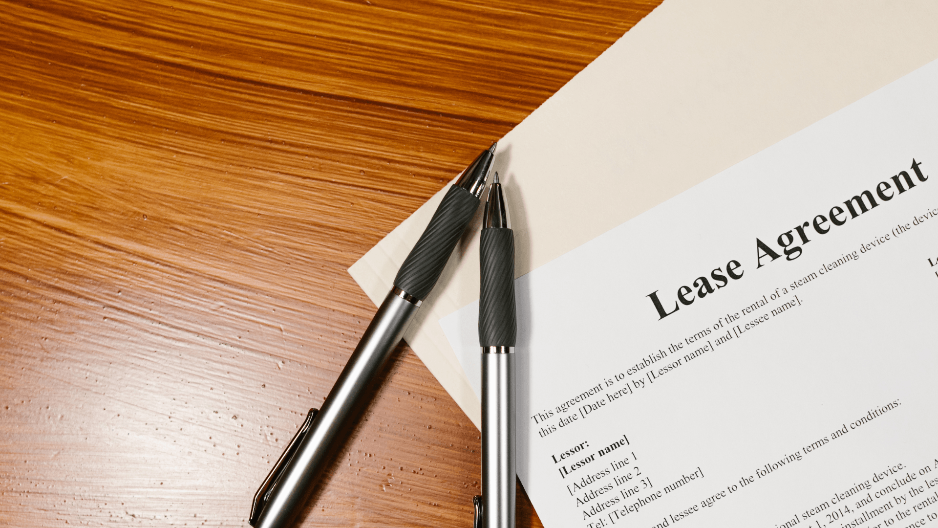Calculator and expense sheet showing office rental cost planning