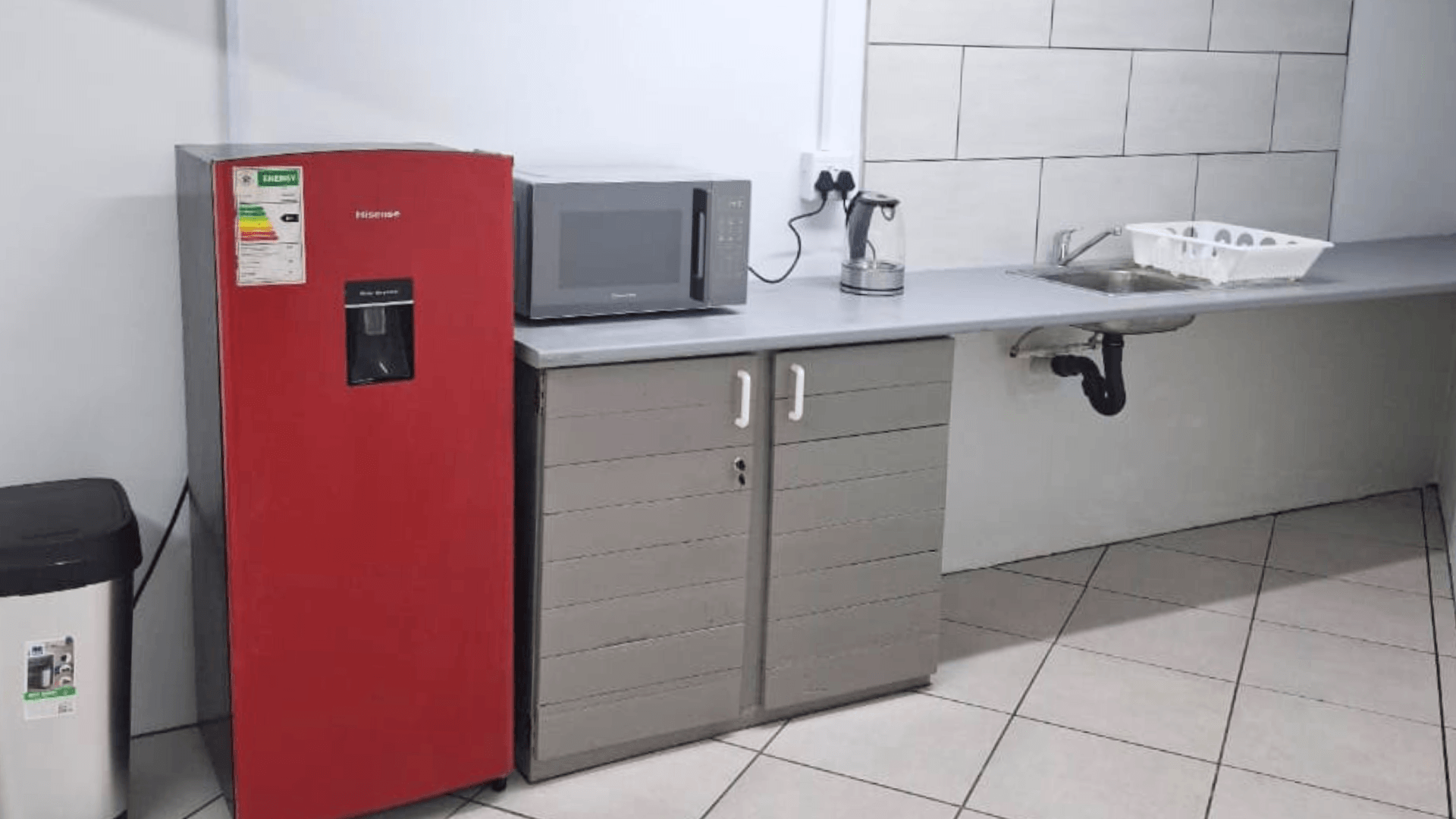 Shared kitchen and practical amenities in office space
